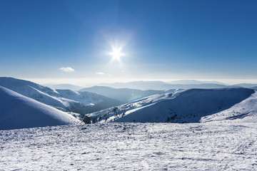 Snowy winter mountains at nice sun day in Carpathians, Dragobrat, Ukraine