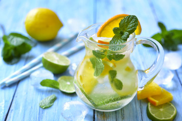 Citrus lemonade in a glass pitcher.