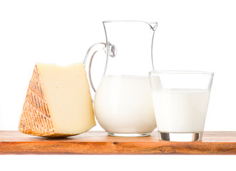 cheese eggs and milk on wood