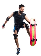 Man with skateboard jumping
