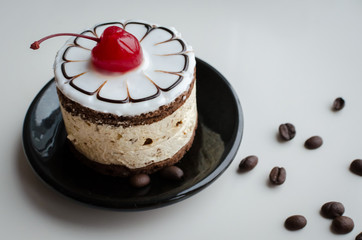 Sweet cake with a cherry