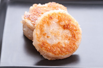 Thai dessert - coconut macaroon on black dish