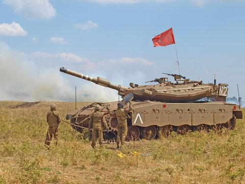 Merkava tanks and Israeli soldiers in training armored forces