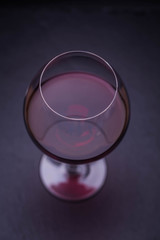 Red wine on a black background 