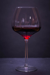 Red wine on a black background 