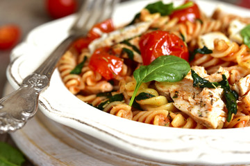 Fusilli with chicken,spinach and cherry tomatoes.