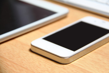 Smartphone and tablet on table
