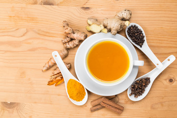 Aromatic turmeric tea with black pepper, cinnamon, cloves and ginger offers many wellness health benefits