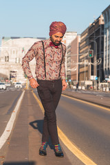 Indian handsome man posing in an urban context