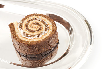 Swiss roll on the metal tray