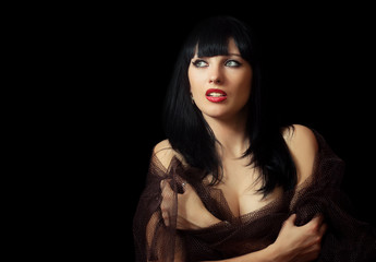 Portrait of a beautiful brunette on black background