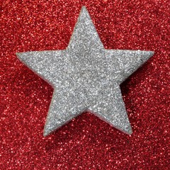 Obraz premium glitter silver star red luminescent background