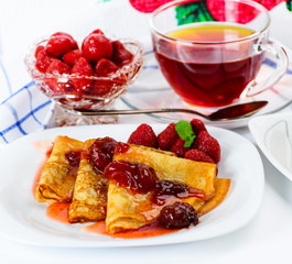 Pancakes with strawberry jam.