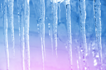 Background of bright transparent icicles in the sunlight - obrazy, fototapety, plakaty