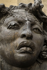 Fototapeta na wymiar Bronze street art - woman sculpture.