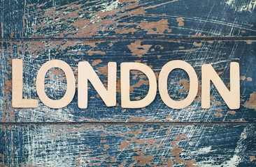 London written with wooden letters on rustic surface
