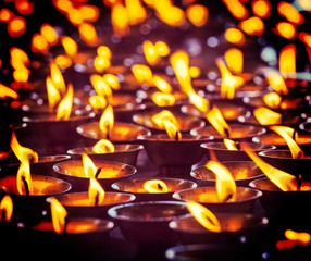 Burning candles in Buddhist temple. McLeod Ganj, Himachal Prades