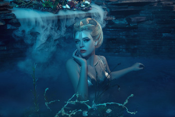 beautiful slim girl in the arms of an octopus, tentacles wrap around the body, fantastic shot,...