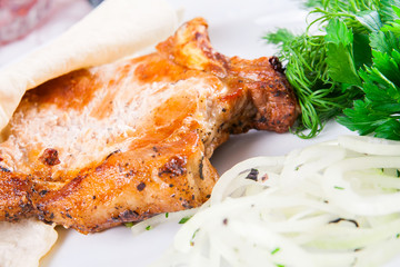 Grilled pork loin on the bone