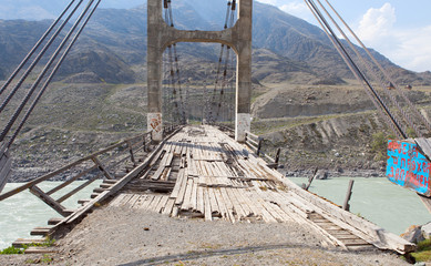 Old bridge over the river Katun, Altai, Russia.