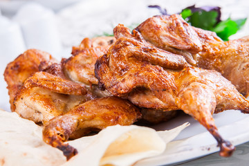Grilled chicken on white plate