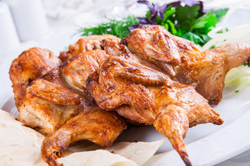 Grilled chicken on white plate
