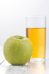 Green apple lying on the table 