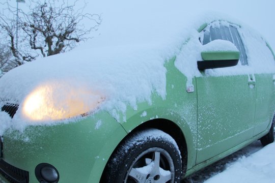 snow covered car in Winter morning