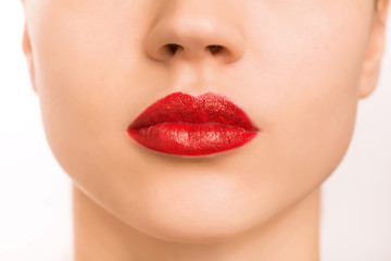 Obraz premium Young girl is wearing make up. 