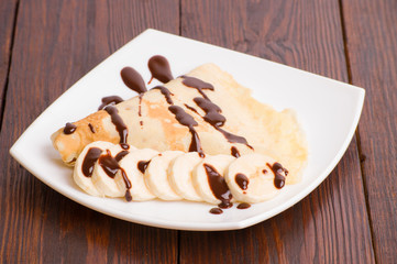 Crepes with bananas and cream 