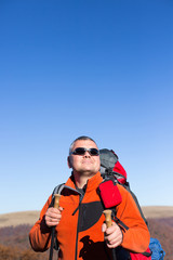 Naklejka premium Hiking - hikers looking at view in Zion National park. People living healthy active lifestyle dong hike in beautiful nature landscape to Observation Point near Angles Landing, Zion Canyon, Utah, USA.
