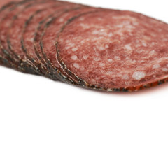 Stack of multiple salami slices isolated