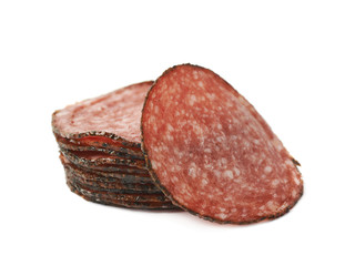 Pile of salami slices isolated
