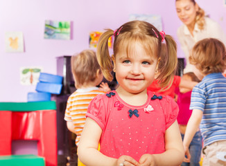 Fototapeta premium Portrait of a girl and kids group on background