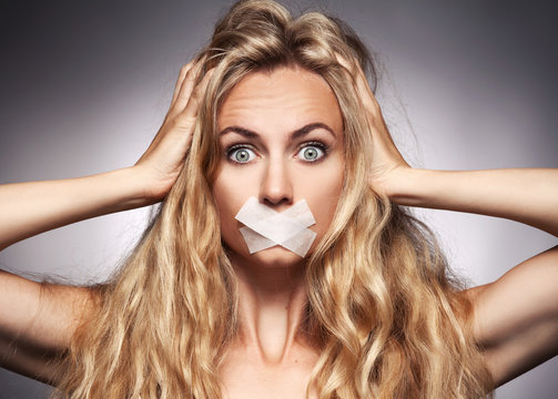 Woman with mouth sealed