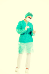 Female surgeon doctor with a scalpel performs the surgery