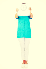 Young doctor or nurse holding weight