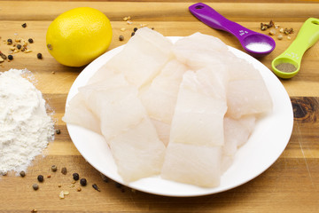 Pollock raw sliced fish and other ingredients for frying