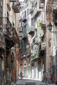 Narrow alley with old houses in the downtown of Palermo (district Kalsa)
