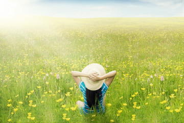 Happy woman enjoy springtime on meadow