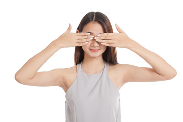 Young Asian woman close her eyes with hands