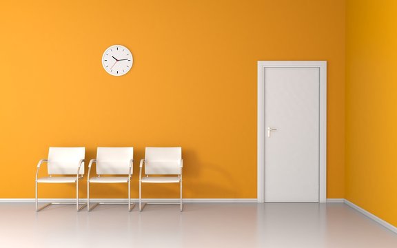 Three chairs and wall clock in the yellow waiting room