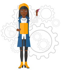 Woman standing on gears background.