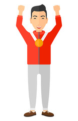 Athlete with medal and hands raised.