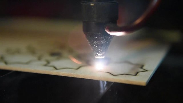 cnc laser  cutting of orient pattern decorative wood, modern industrial technology