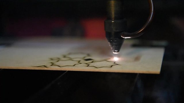 cnc laser  cutting of orient pattern decorative wood, modern industrial technology