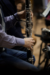 Fototapeta premium Hands musician playing bass clarinet