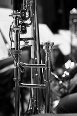 Detail of a trombone on stage close up in black and white 