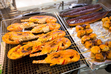 Roasted lobster and scallop at fish market