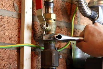 Gas pipe man connecting / Engineer connecting a copper gas pipe in a home.